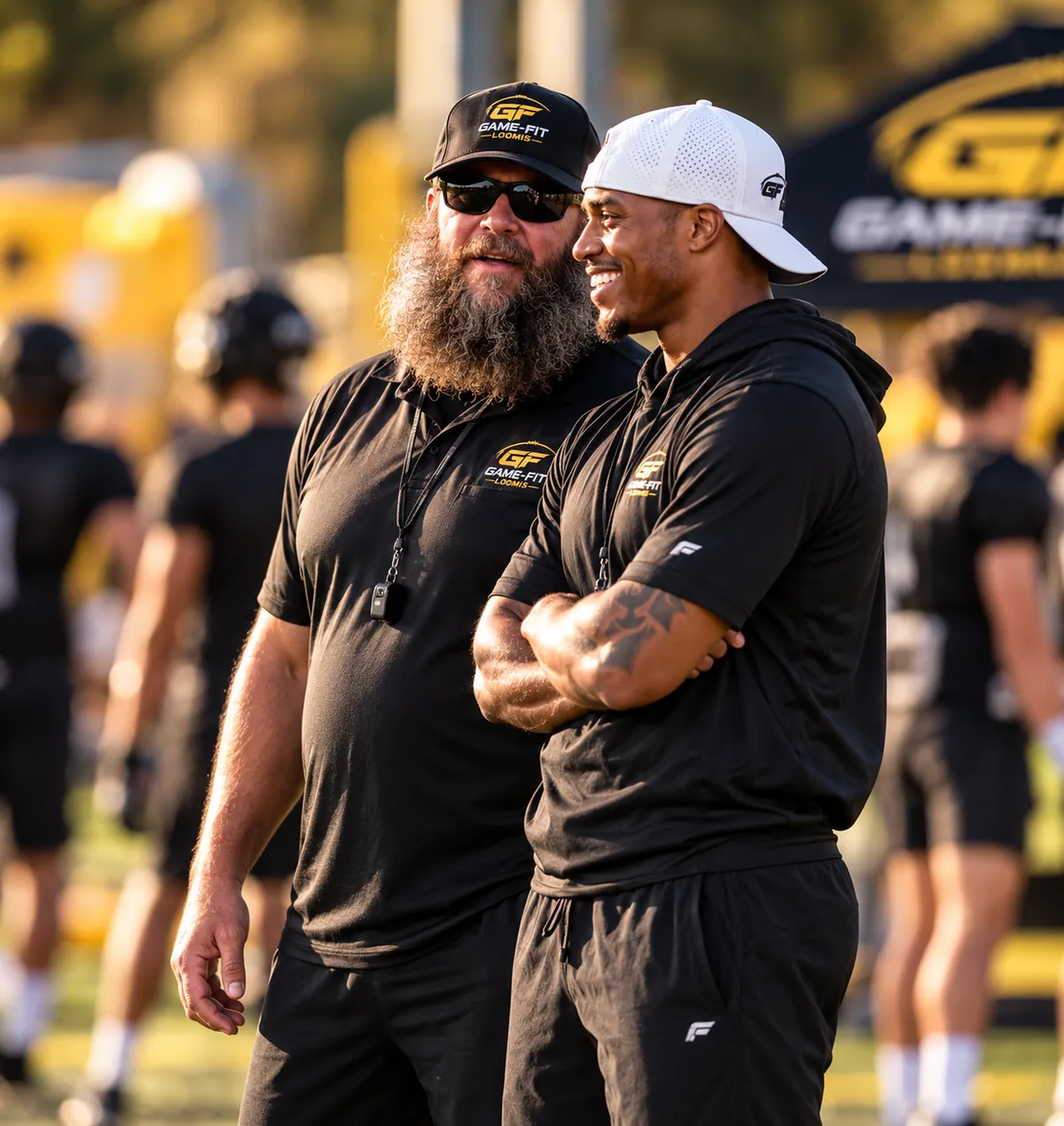 Coaches Josh Parry and Lem Adams on the field